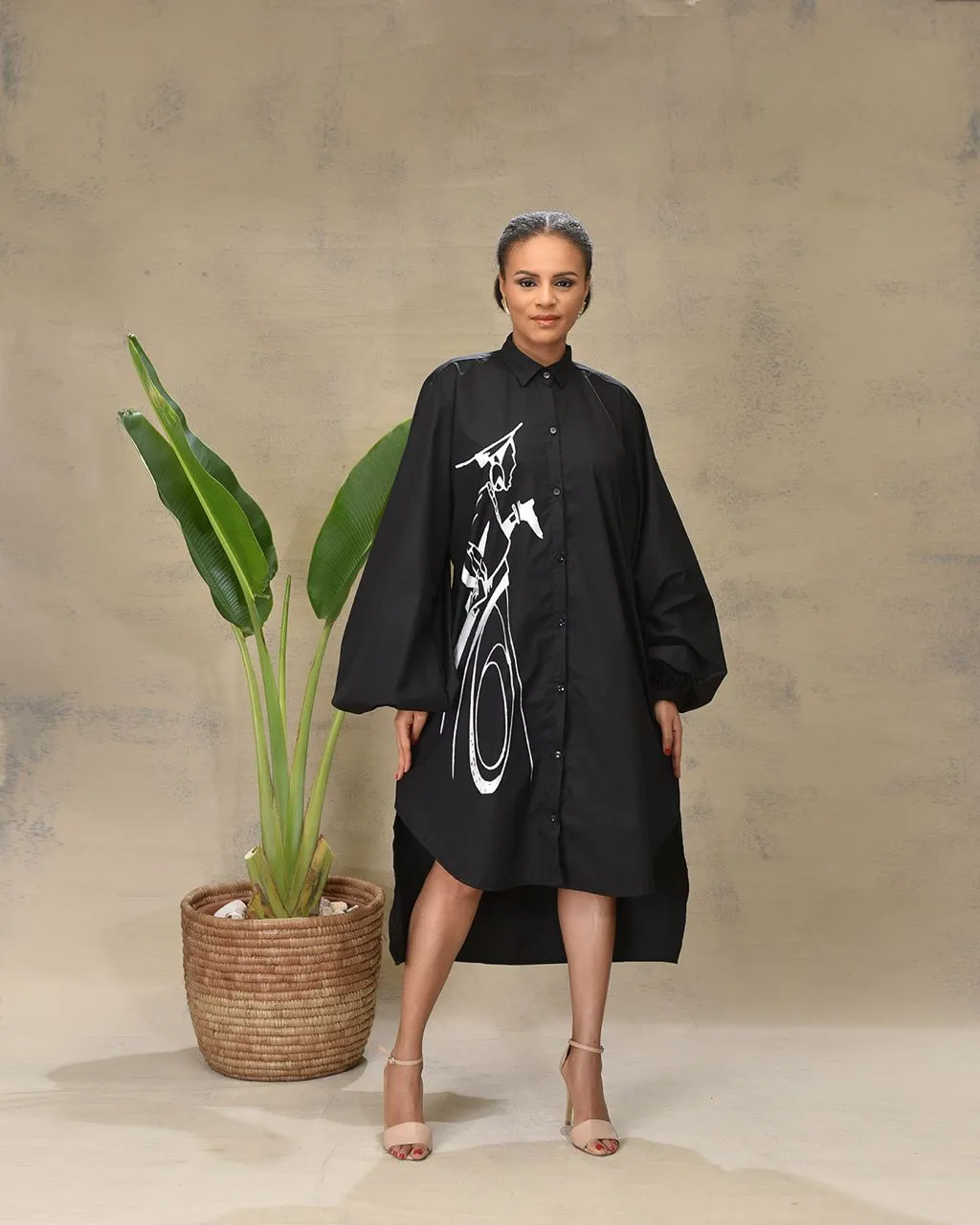 Aimas Khosi Shirt Dress with dramatic sleeves and woman image